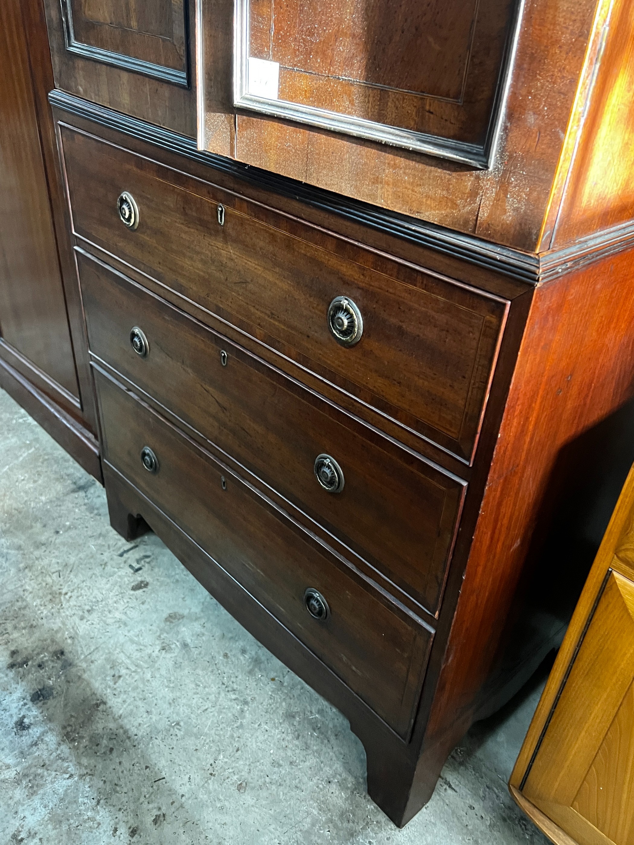 An early 20th century Regency style narrow mahogany linen press, width 92cm, depth 54cm, height 220cm